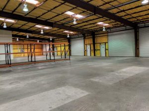 Large open warehouse with 4 rollup doors